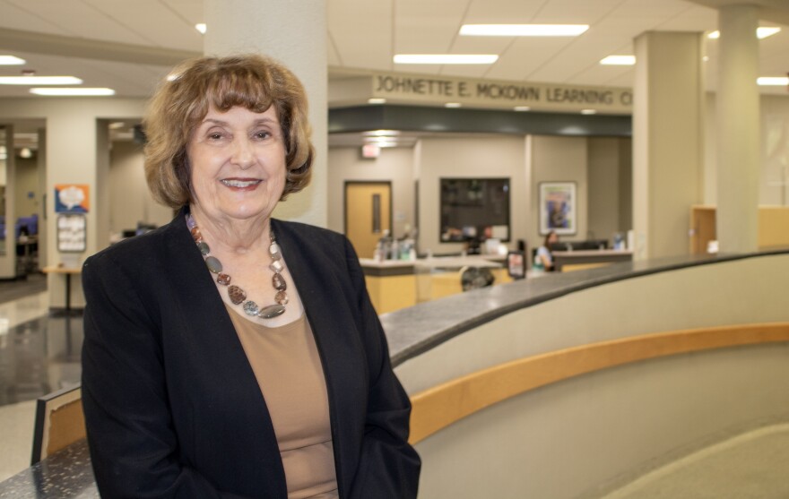 Johnette McKown, president of MCC, poses for a photo in front of the learning commons named in her honor. McKown announced she would retire in May after 17 years as president.