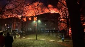 Firefighters work to put out a fire on the third floor of a building at Camden Westwood apartments in Morrisville on February 23, 2026