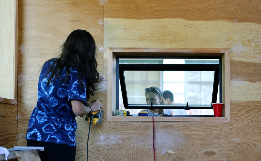 The interior of The Nest, as the students call it, was designed to accomodate the needs of one or two people, within a 12 foot by 12 foot space. Ventilation was very important, and Sawhorse spent a large part of their budget on quality windows.