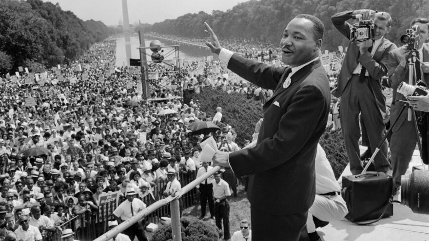 Martin Luther King Jr. stands in front of a crowd in Washington, D.C.