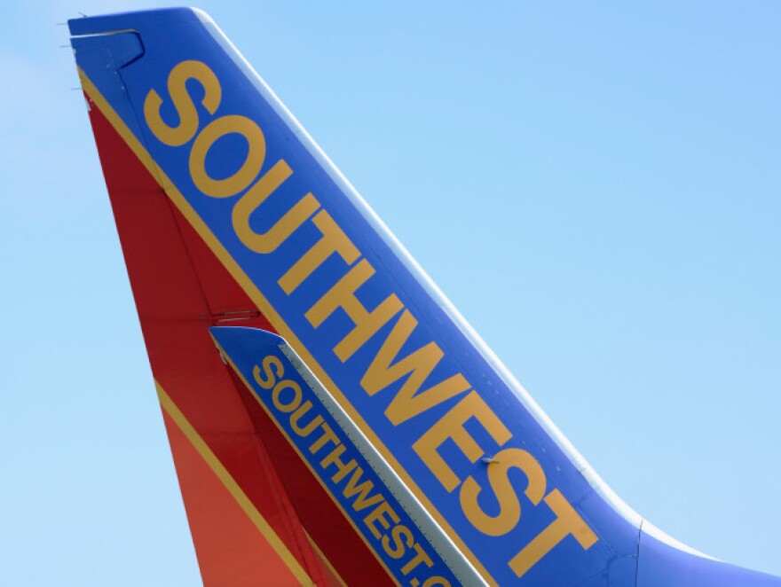 A Southwest Airlines passenger plane taxis on the tarmac at Los Angeles International Airport. Southwest and other smaller carriers have filed a lawsuit against new rules regarding airfare advertisements.