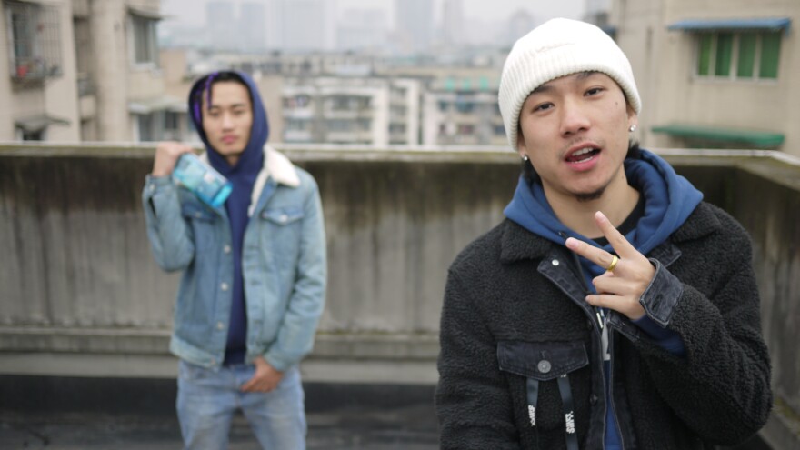 Rappers Young13DBaby (left) and TSP beside their rooftop studio in downtown Chengdu. The two rappers are both Tibetan and sometimes write songs about growing up as ethnic minorities in Han-majority China.