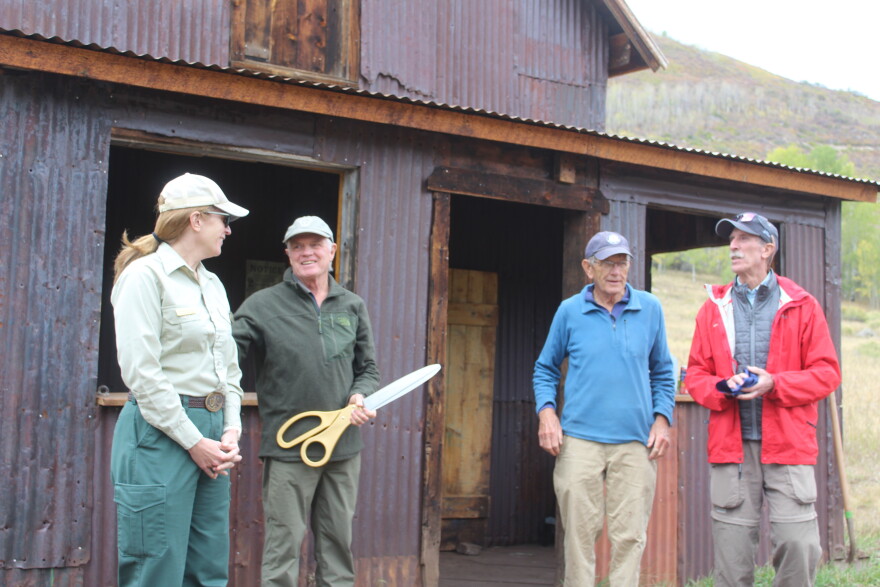Representatives from the U.S. Forest Service and the Hunter Creek Historical Foundation participate in a ribbon-cutting ceremony at the Koch Homestead site in the Hunter Creek Valley on Sept. 24, 2026.