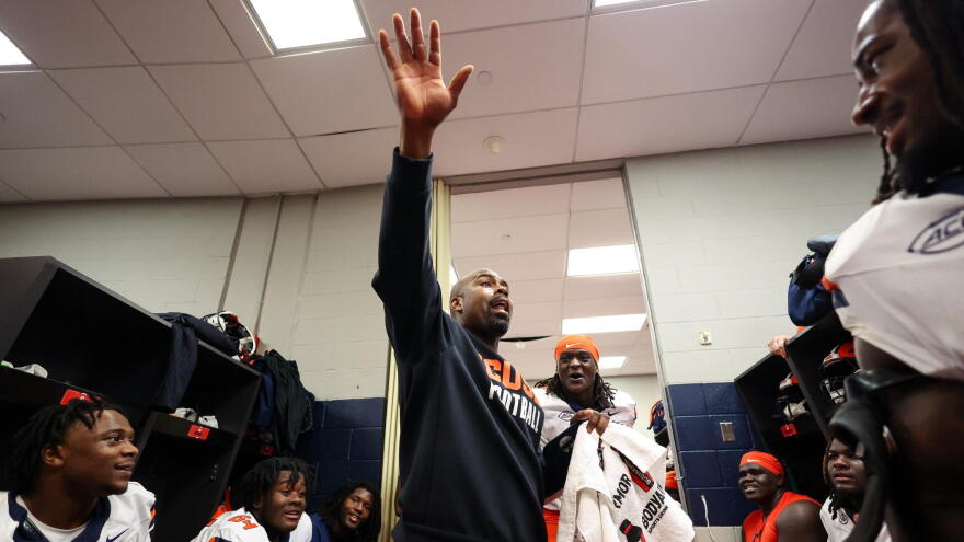 Syracuse head coach Fran Brown (Navy) rallying the Orange