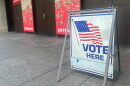 A "Vote Here" directs voters into the National WWl Museum & Memorial on August 4, 2026.