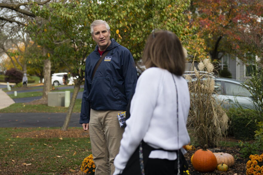 Todd Stephens (left), a Republican state representative running for reelection, speaks with supporter Linda McKillen as he goes door-to-door in his district in October.