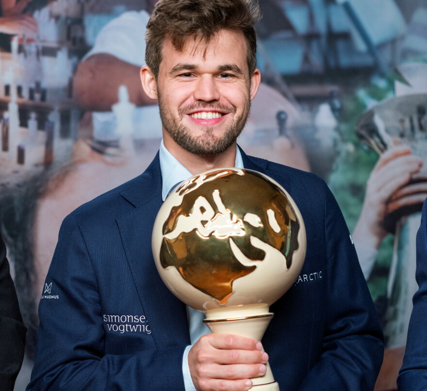 Norwegian Magnus Carlsen holds the 2019 Croatia Grand Chess Tour trophy.