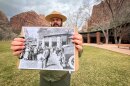 Park education supervisor Jorge Hernandez holds a historic photo of the Zion Lodge in front of the hotel’s modern entrance, Feb. 11, 2026.