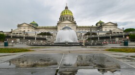 FILE - The Pennsylvania State Capitol is reflected on the ground June 30, 2025, in Harrisburg, Pa.