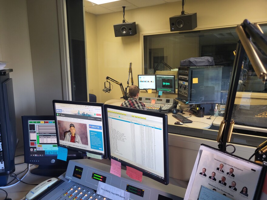 Morning Edition host Nyk Daniels records the latest weather forecast at the KGOU studios.