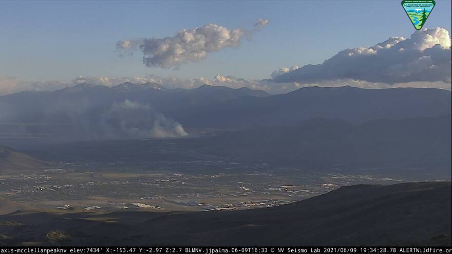A screenshot from an ALERT Tahoe camera showing smoke billowing.