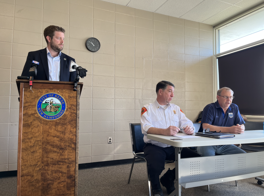 Keene Mayor George Hansel, Fire Chief Donald Farquhar and Airport Manager David Hickling speak at a press conference on the crash.