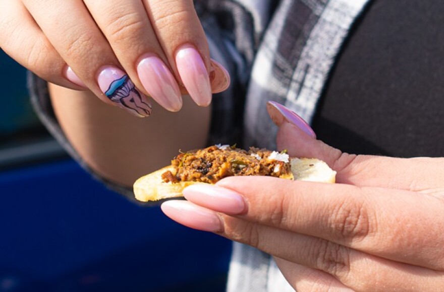 Dk sprinkles sea salt on bread topped with mushroom duxelles, a spread she made with foraged chanterelle and morels mixed with shallots, herbs, and sherry.