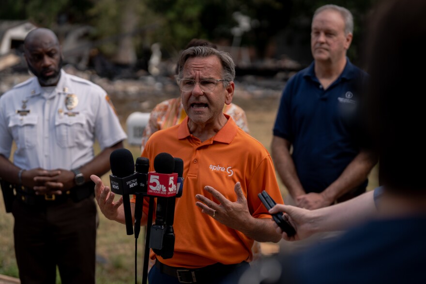 Jason Merrill, Spire’s Director of Public Relations, speaks to the press after a home exploded, damaging more than a dozen residences, on Monday, Aug. 25, 2025, near Black Jack.