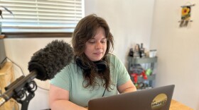 KUNM's newest reporter Megan Myscofski works from her home in Santa Fe on May 9, 2023. She'll focus on topics of public health, poverty and equity through her position funded in part by the W.K. Kellogg Foundation.