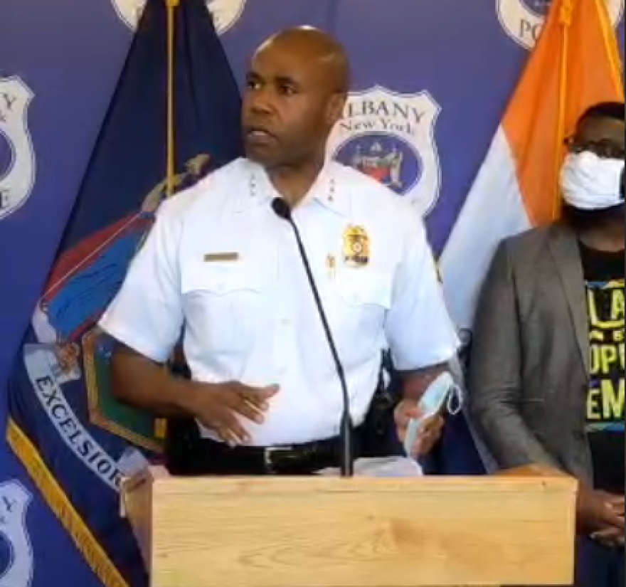 Albany Police Chief Eric Hawkins fields reporters' questions at police HQ.