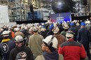 Shipbuilders at Newport News Shipbuilding watch as Secretary of Defense Pete Hegseth gives remarks before the future Virginia-class submarine Oklahoma.