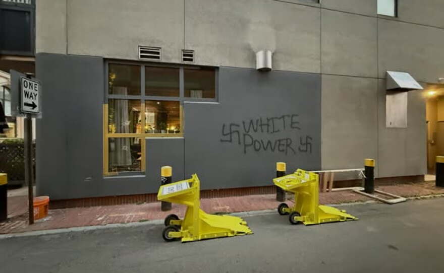 Vandals spray-painted white supremacist graffiti outside the Moka Pot coffee shop in Manchester early Wednesday.