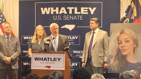 Man speaks at podium