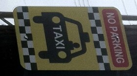 The Taxi Cab stand sign at 18th and Boston.