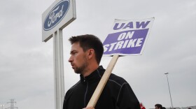 UAW workers picket outside of Ford's Wayne Assembly Plant in Wayne, Mich., on Sept. 26, 2023. The union and Ford reached a tentative agreement on Wednesday, in a major potential development in the ongoing strike against the Big Three automakers.