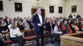 Former Miss Hall’s School teacher Matthew Rutledge is surrounded by a courtroom filled with people wearing orange hearts and orange clothing in solidarity with his accusers as he is arraigned on three felony counts of rape in Berkshire Superior Court in Pittsfield on Wednesday. (Stephanie Zollshan/The Berkshire Eagle)
