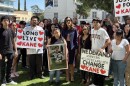 Family, friends and a legal representative holding signs regarding Rubio’s case outside the Fresno County Hall of Records while filing a government claim on the morning of Wednesday, July 8, 2026.