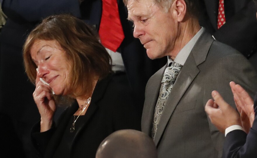 The parents of Otto Warmbier react to a standing ovation during President Trump's Jan. 30, 2018, State of the Union address on Capitol Hill in Washington.