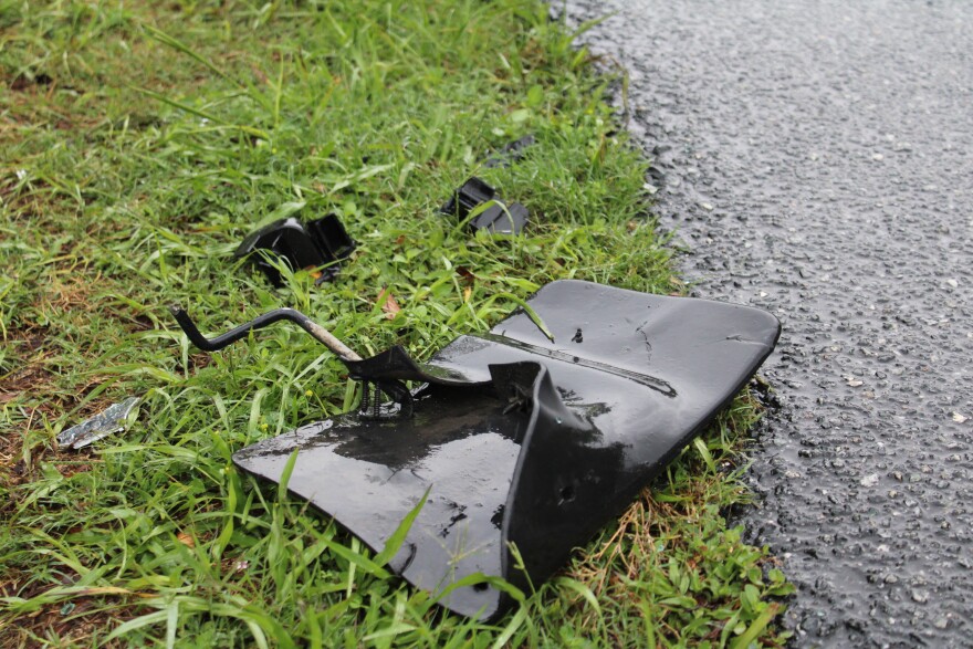 Debris on State Road 40 west of Ocala following a fatal bus crash, killing eight people. (Ella Thompson/WUFT News)