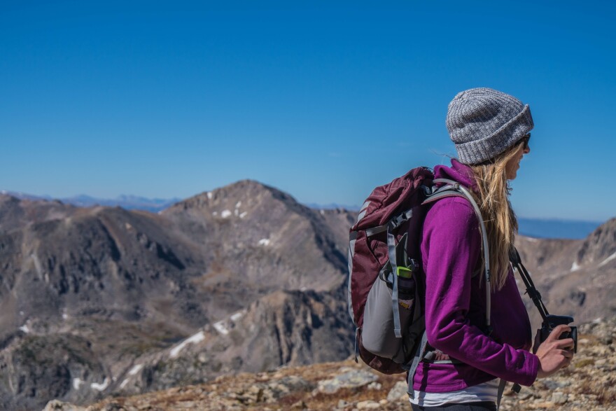 Woman in the mountains. Stock photo.