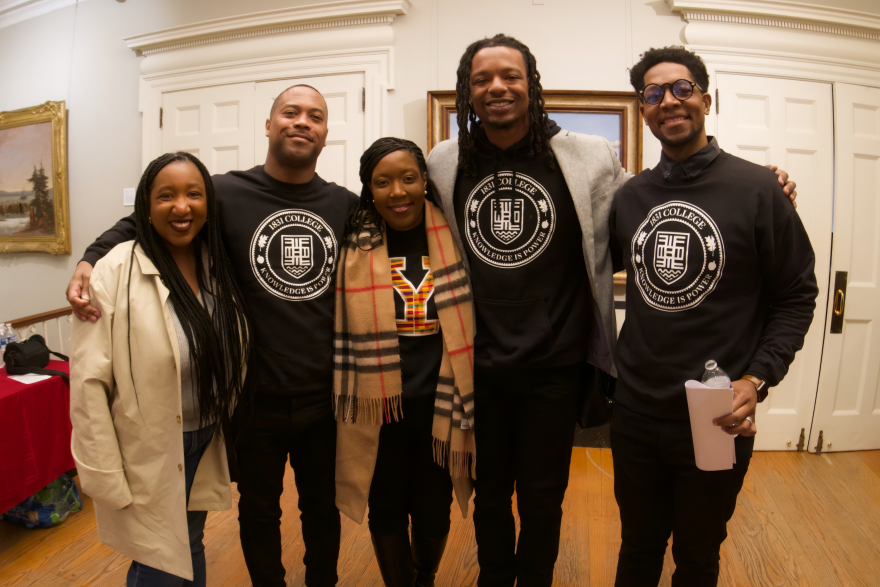 The exhibit's opening night, with the crest of the 1831 College printed on t-shirts. From right: David Jon Walker, Tubeyez Cropper, Tamika Hollis, exhibit co-curator Charles Warner Jr., Daisha Brabham.