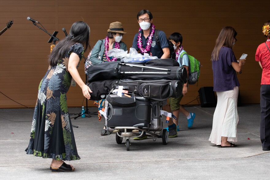 Passengers on Japan Airlines flight 177 arrive at Ellison Onizuka Kona International Airport on Tuesday, Aug. 2, 2022.