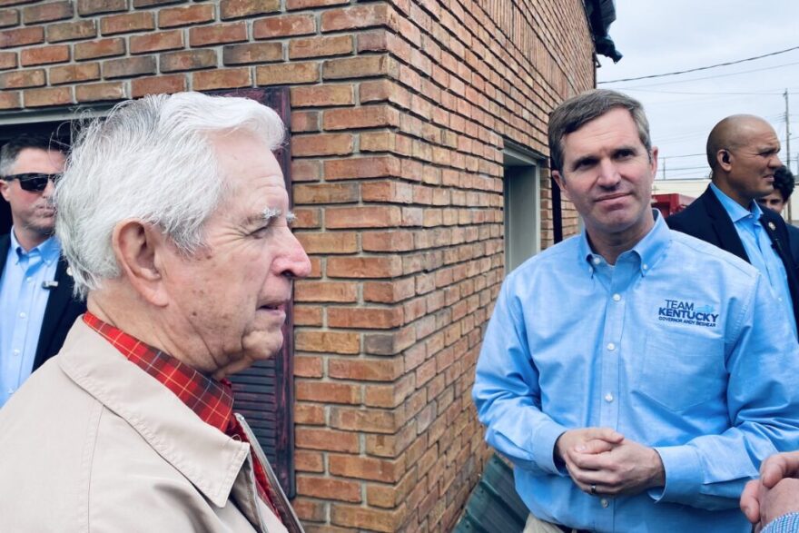 Christian County Historian William T. Turner (left) speaks with Gov. Andy Beshear outside Big Fella’z restaurant on East Ninth Street. The restaurant was among dozens of structures damaged during the March 31 storm.