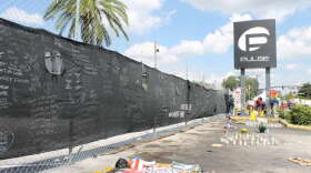 The privacy screen on the old fence is also being removed for storage by the Orange County Regional History Center. Photo: Matthew Peddie, WMFE