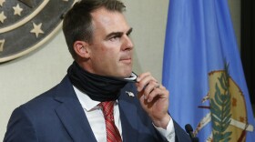 With his face mask down around his neck, Stitt encouraged Oklahomans to wear a face mask, but said that he will not consider placing a face mask mandate on Oklahoma.