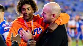 Jaden Rashada hugs UF assistant coach Rob Sale during his campus visit in November 2022. (Matt Pendleton/USA TODAY NETWORK)