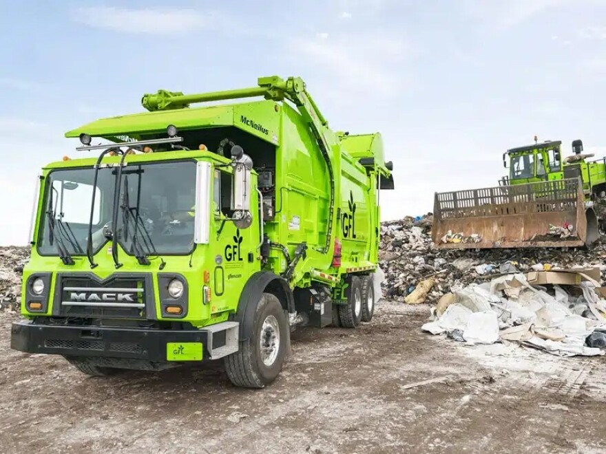 GFL trucks working at a landfill.