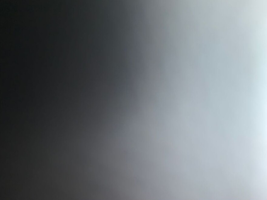A rectangle of black-gray color gradually changing to a light-gray