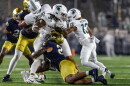 Notre Dame linebacker Kyngstonn Viliamu-Asa tackles Michigan State running back Cam Edwards