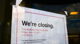 A sign on the front of a former KeyBank branch in South Bend warns customers it will be closing.