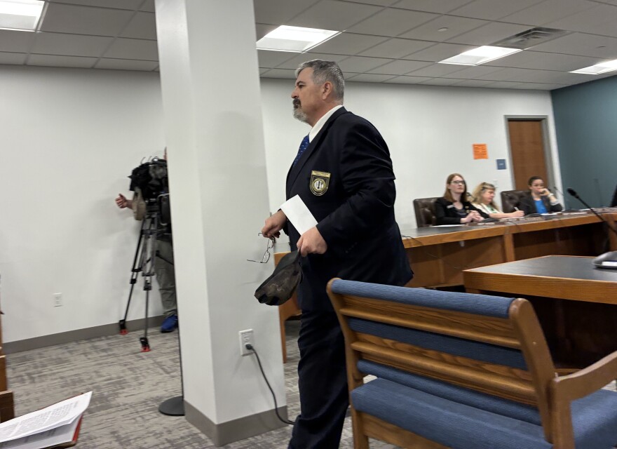 Rep. Travis Corcoran of Weare leaves a House committee hearing after testifying about his social media posts, including one calling for a "final solution for theater kids." Corcoran did not take questions from the committee after his testimony.