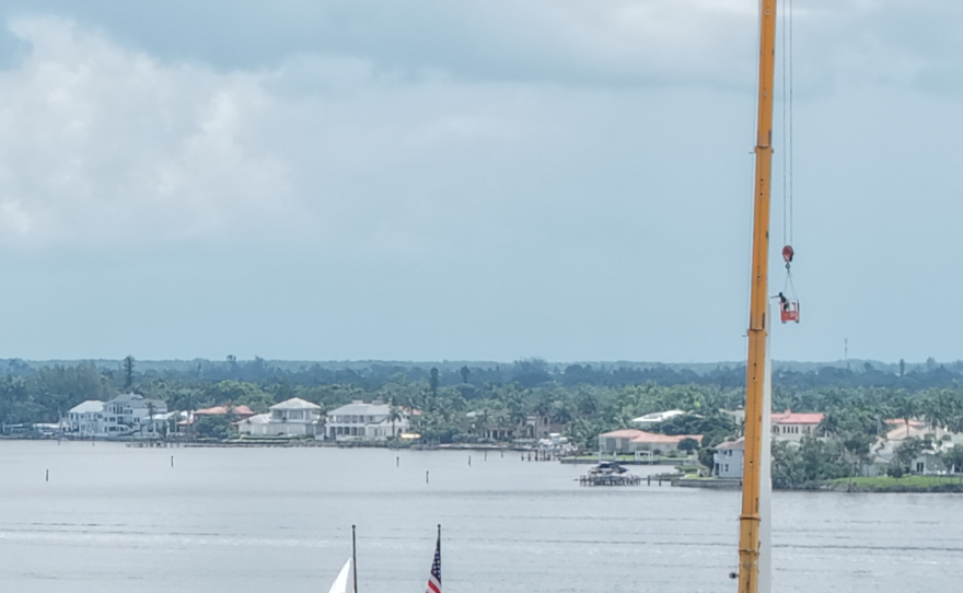 Workers help to install the 250-foot flagpole that will welcome visitors to Cape Coral. The flagpole will be officially unveiled Saturday.