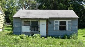 A neglected house sits at 3611 Norton Ave. in Kansas City, Missouri. The house was reported as a dangerous building to 311 in May 2021. The case remains open.