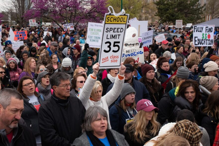 Teachers, students and supporters march in front of the State Capitol on April 2, 2018, the first day of a teacher walkout aimed at increasing education funding.