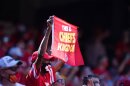 A Kansas City Chiefs fan holds a flag during the first half of an NFL football game against the Las Vegas Raiders, Sunday, Oct. 11, 2020, in Kansas City. The team has picked up fans across Missouri after their 2020 Super Bowl win.(AP Photo/Jeff Roberson)