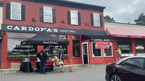 A photo of Cardona's market in Latham. It's a red brick building.