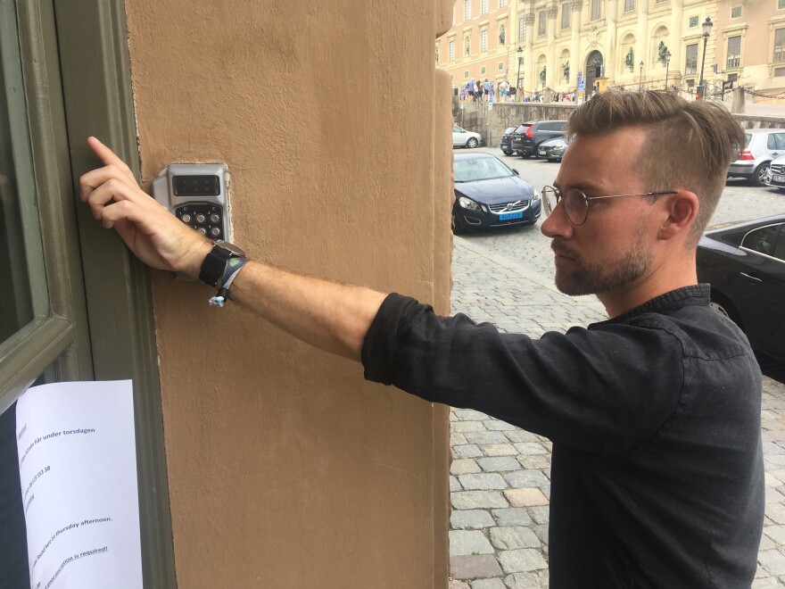 Erik Frisk, a Web developer and designer, uses his implanted chip to unlock his office door in Stockholm.