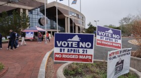 Voters walk outside the Fairfax County Government Center during early voting for the Virginia redistricting referendum, Friday, April 3, 2026, in Fairfax, Va.