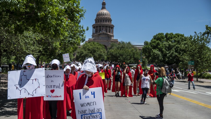 Leaders at two dating app giants in Texas — Match Group and Bumble — have moved to set up funds to aid people affected by the state's new abortion ban. Here, abortion-rights supporters march near the Texas state capitol in Austin earlier this year.