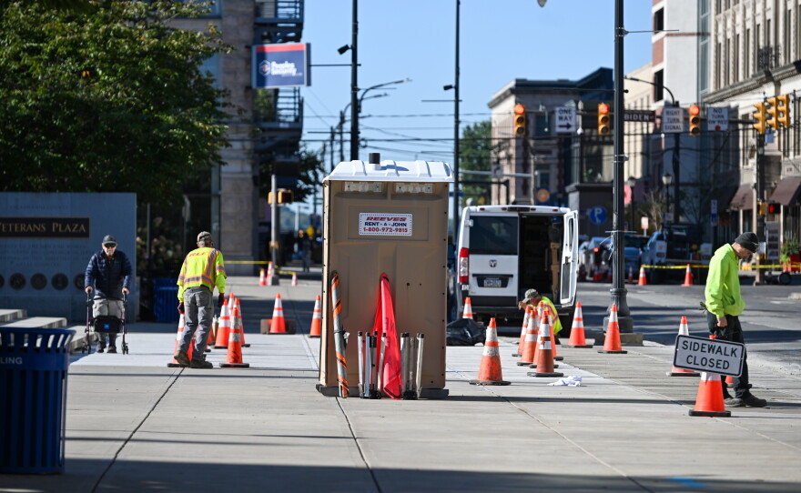 Crews work on replacing sidewalks outside of Lackawanna County Courthouse on North Washington Avenue in Scranton.
